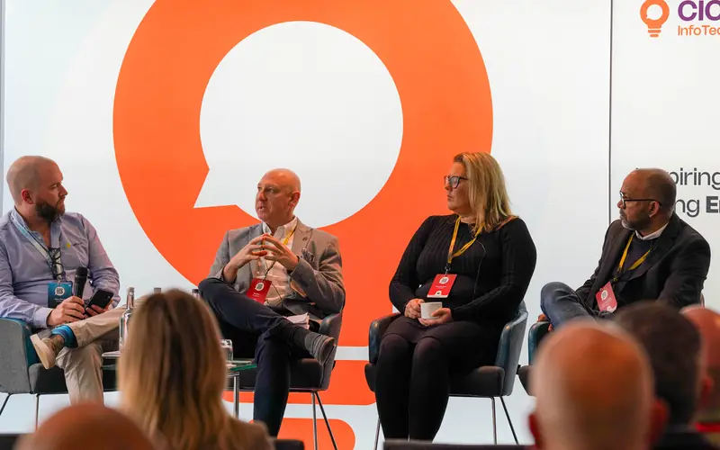 Panellists in conversation on an Inspired Summit stage