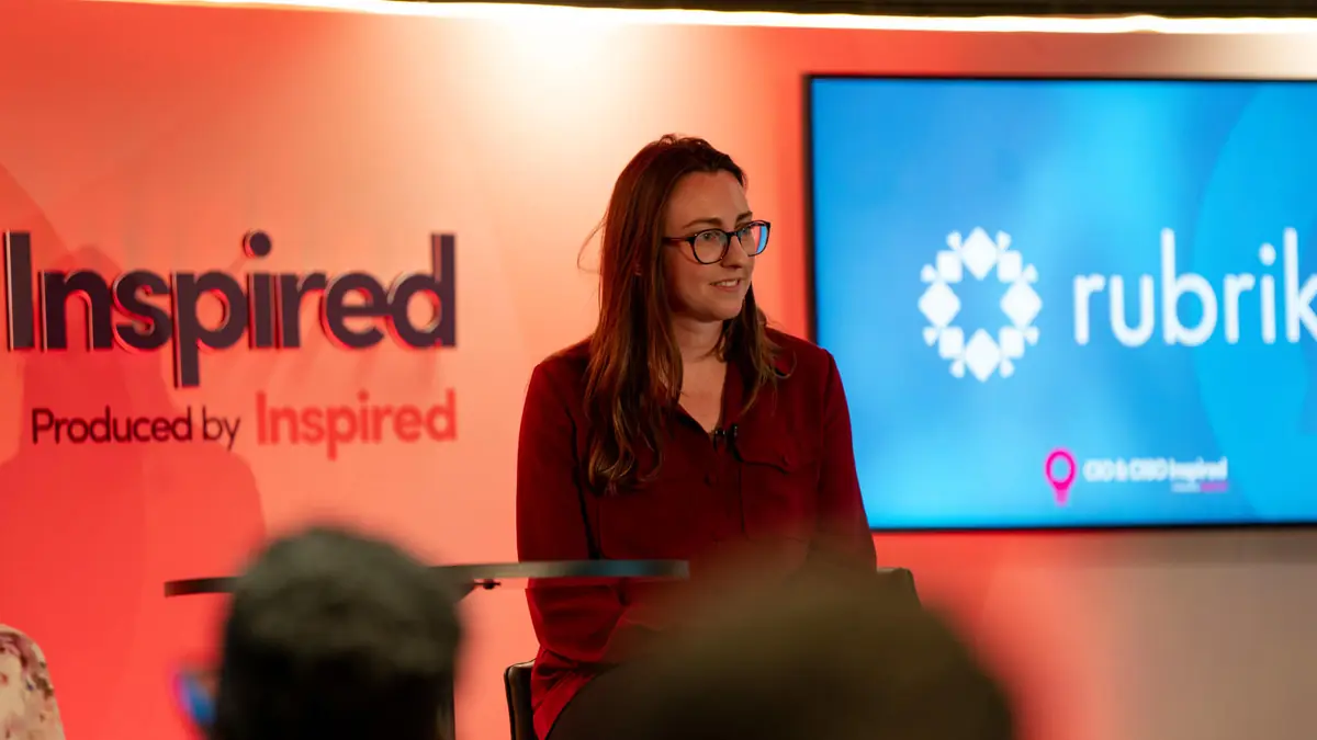 Host on stage at an Inspired Summit